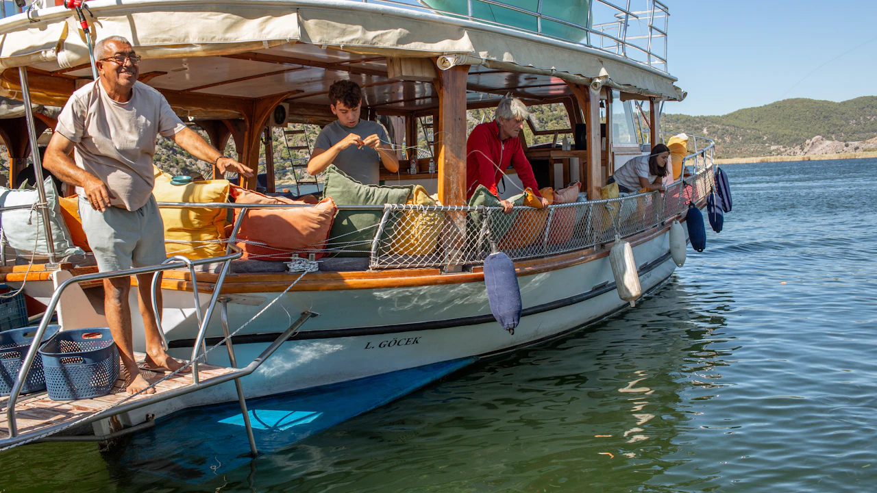 People on the deck of a wooden boat
