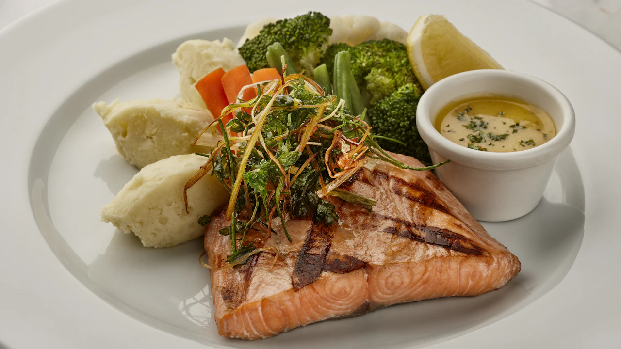 Grilled salmon fillet with vegetables on a plate