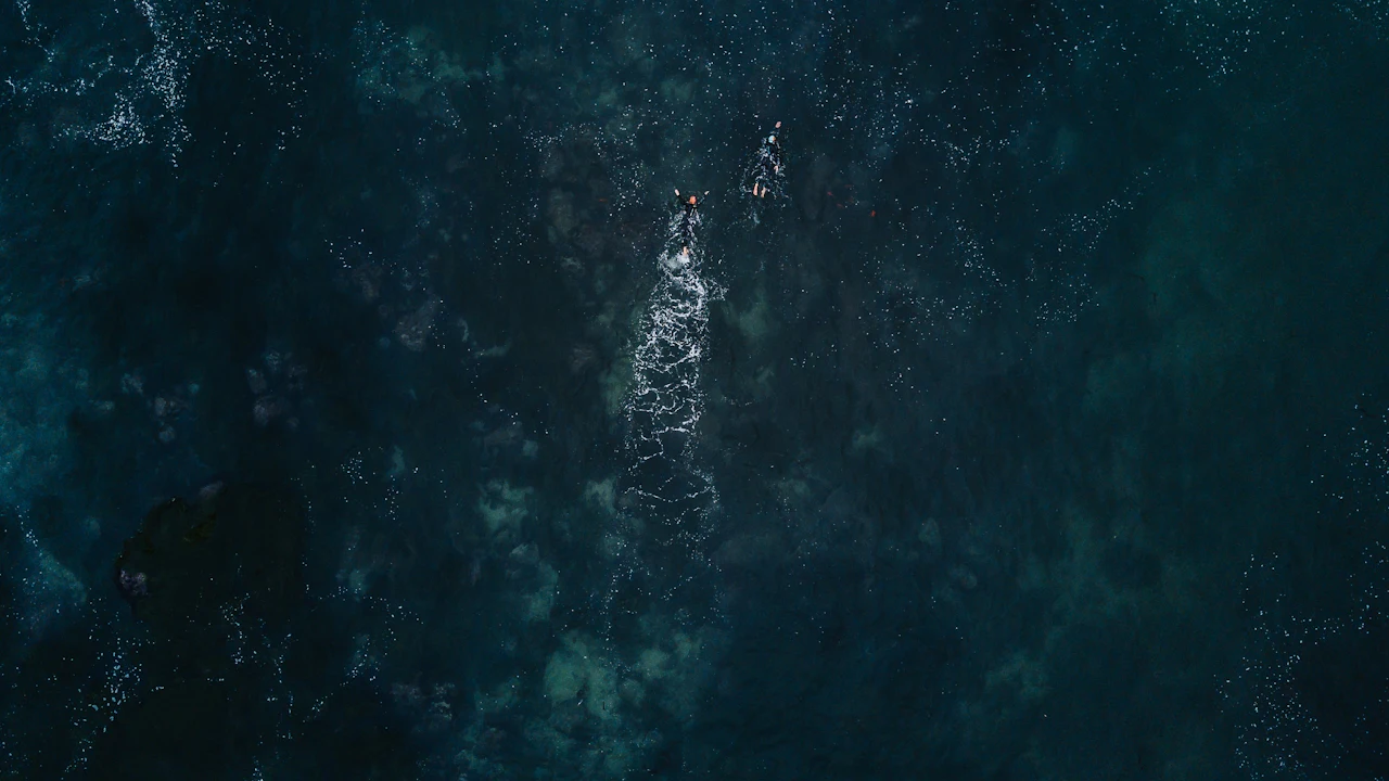 Looking down into dark, deep blue ocean water