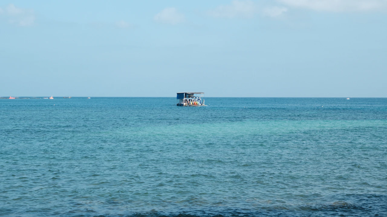 Boat anchored on calm turquoise water