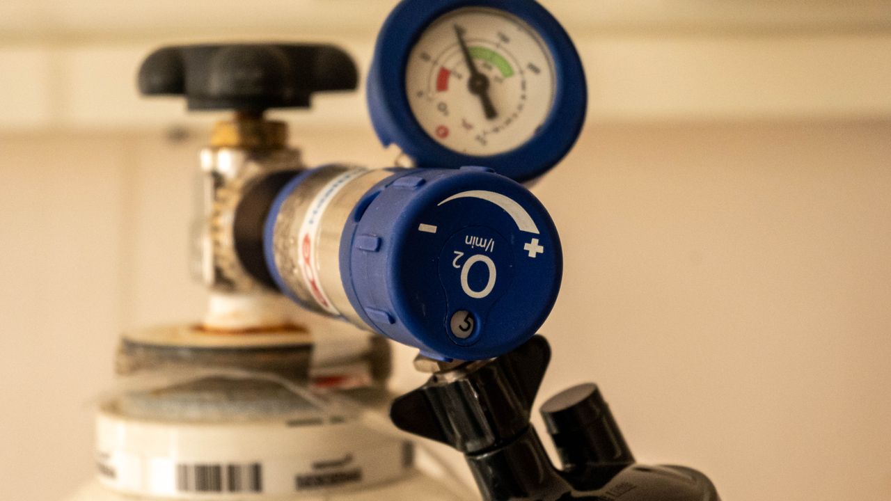 Medical oxygen cylinder with a pressure gauge and regulator