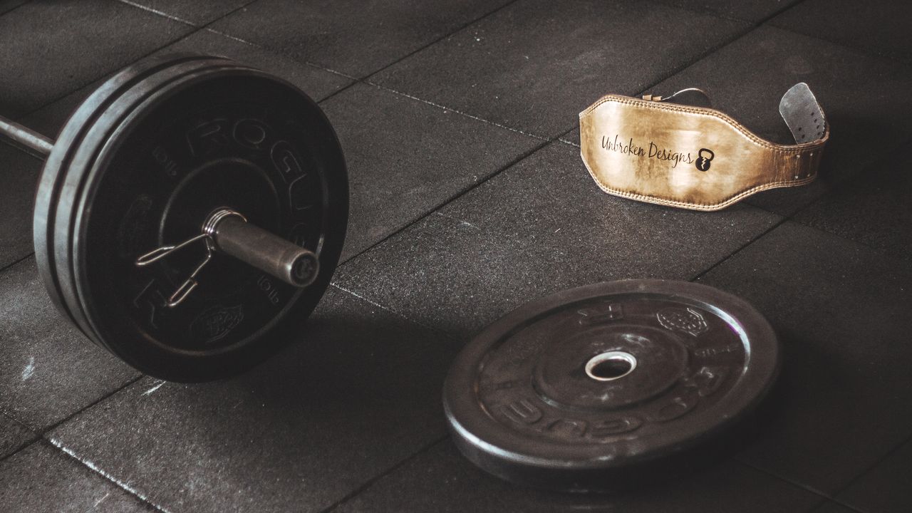 Diving weight belt with lead blocks lying on a wooden deck
