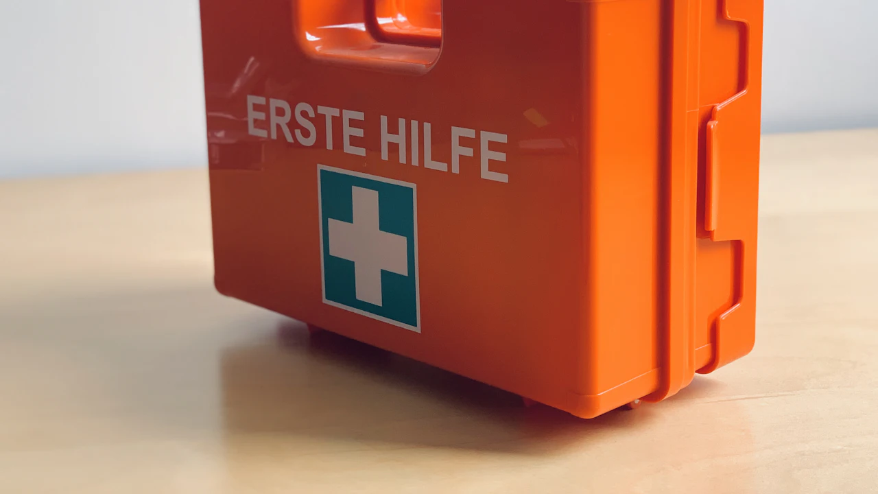 Orange first aid kit on a table