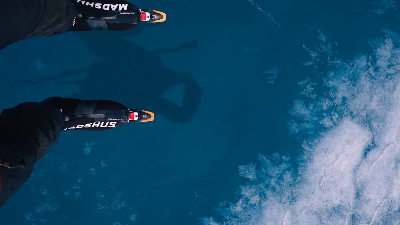 Scuba diver's fins near the surface in blue water