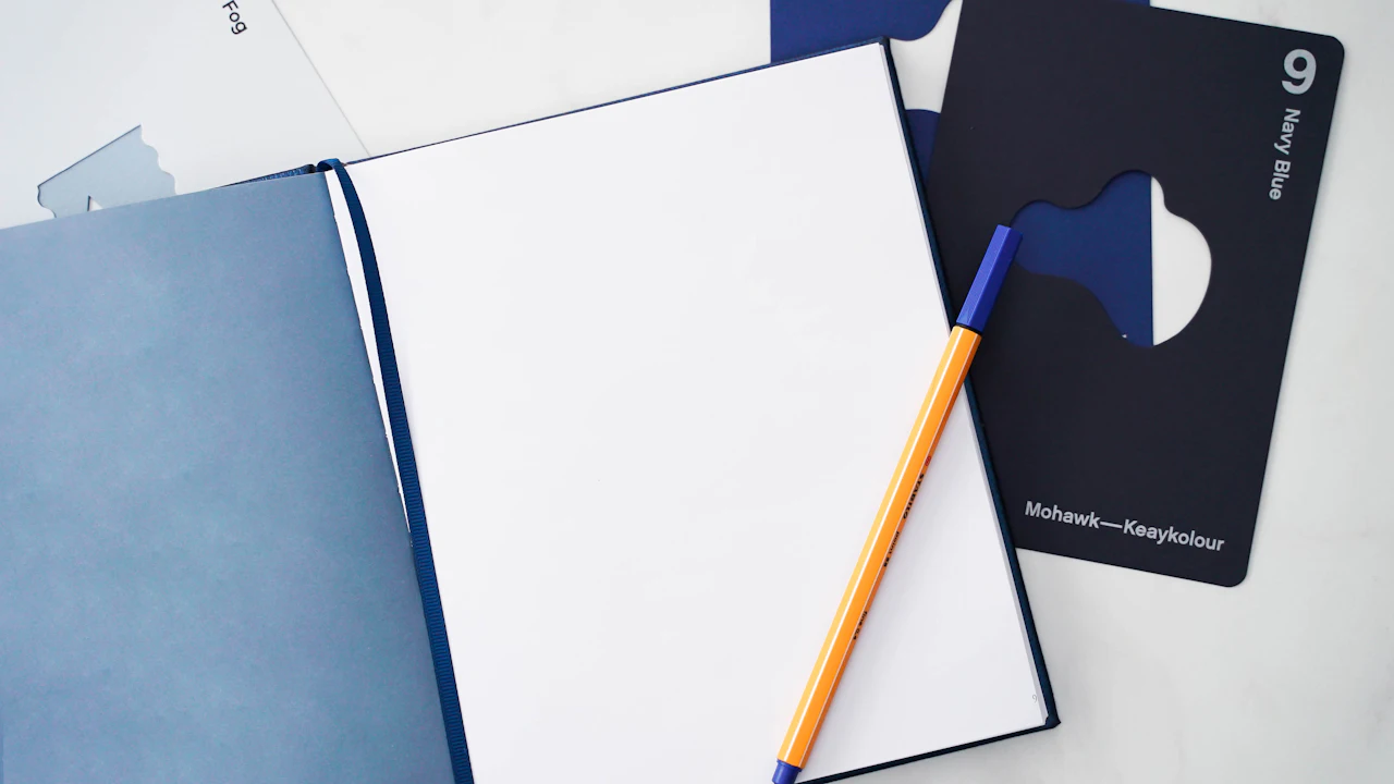 Open notebook and pen on a table