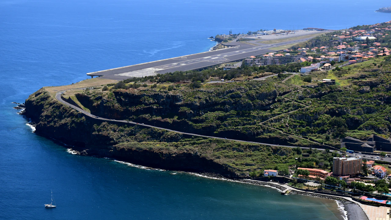 Airport runway on a green coastal headland