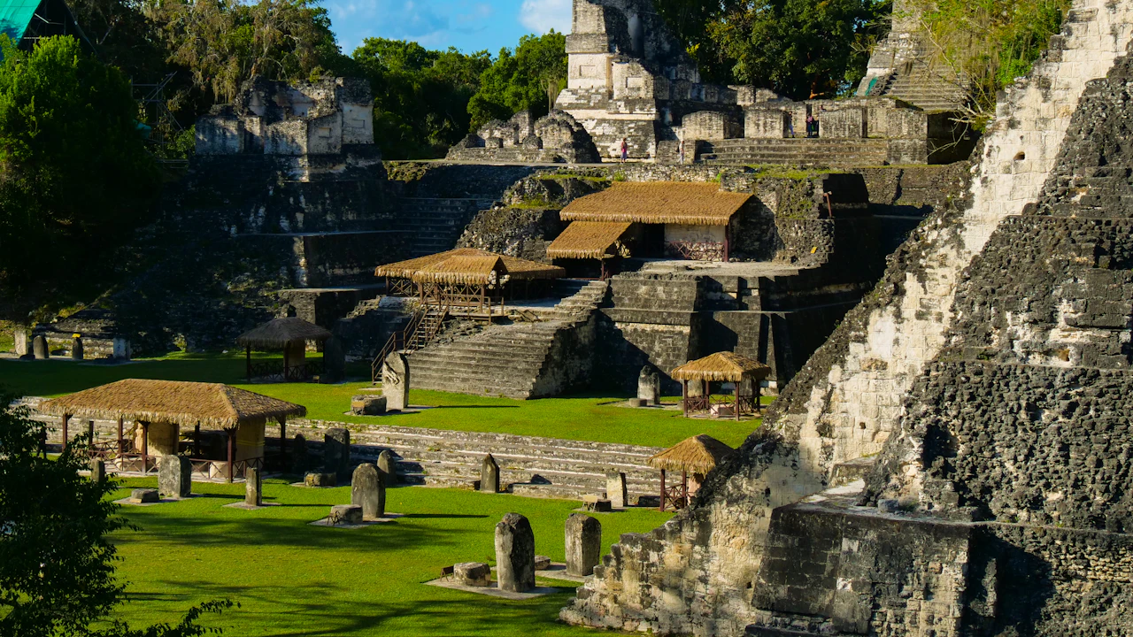 Ancient Maya stone ruins surrounded by jungle