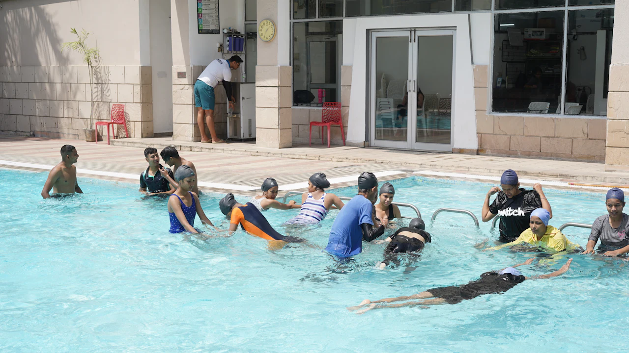 Swimming pool full of students in a training session