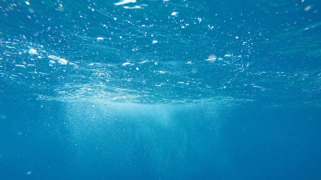 Light filtering through blue water