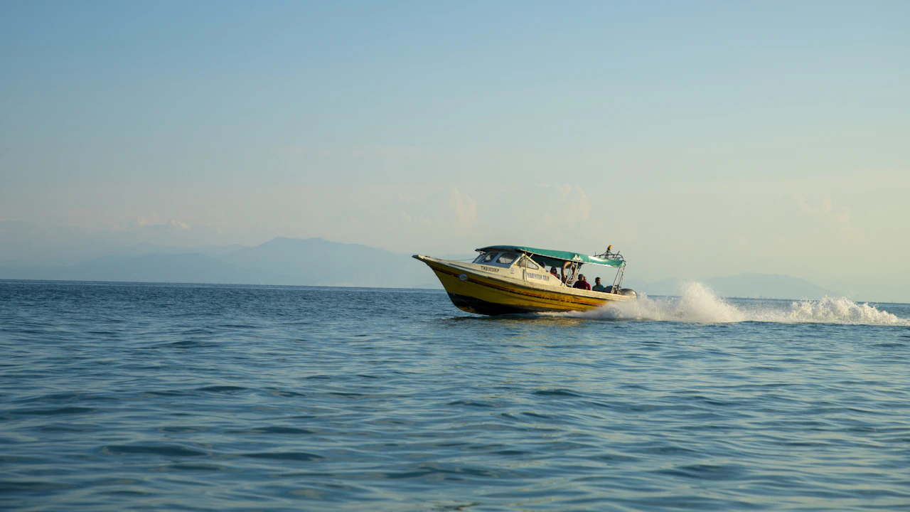 Small speedboat cruising across calm open sea