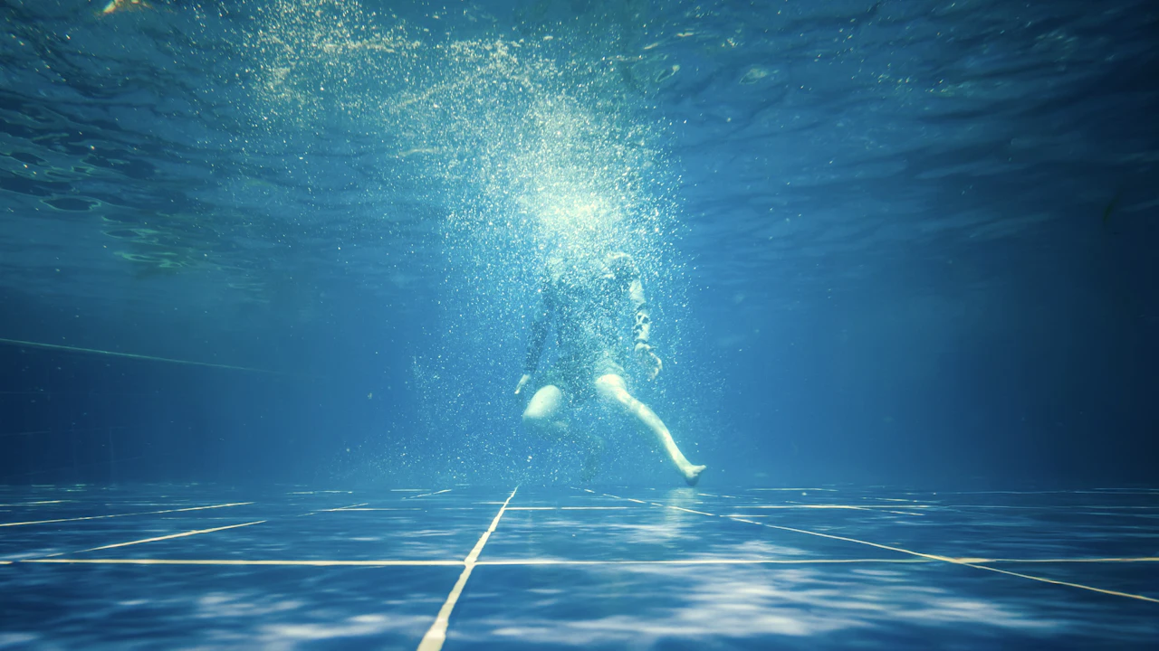 Diver underwater in a swimming pool