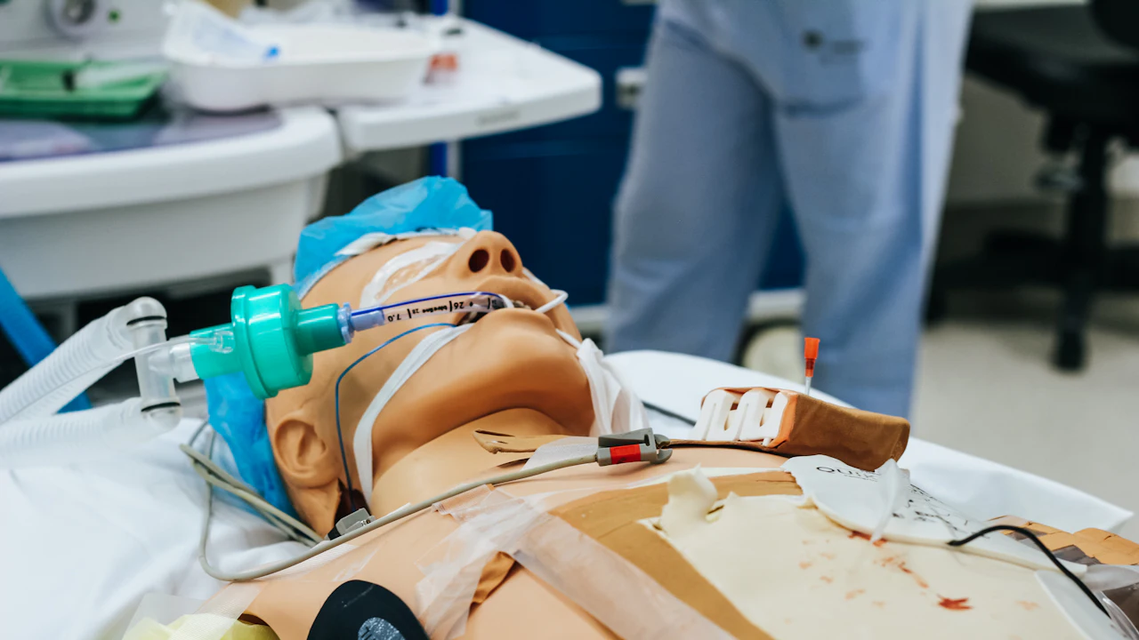 Training manikin with an airway mask in a first aid class