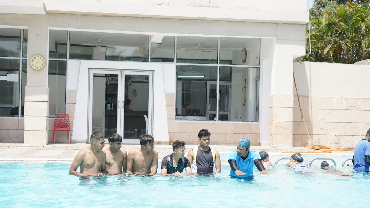Group of swimmers lined up in a pool