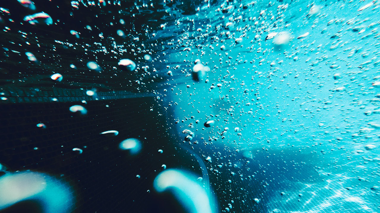 Bubbles swirling just below the water surface