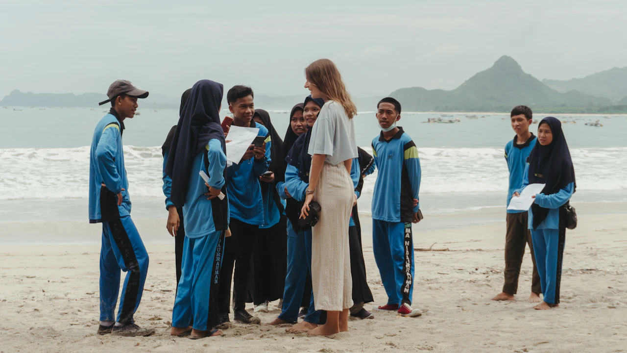 Group in uniforms gathered on a beach