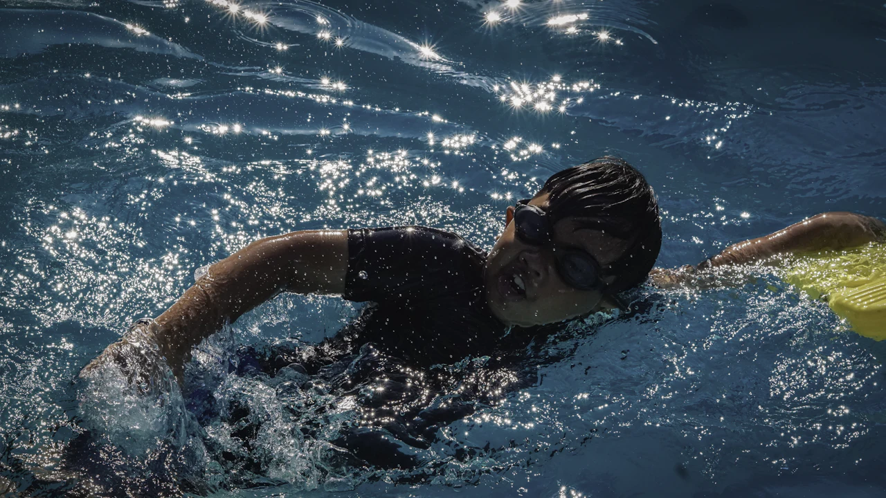 Swimmer doing front crawl in a pool
