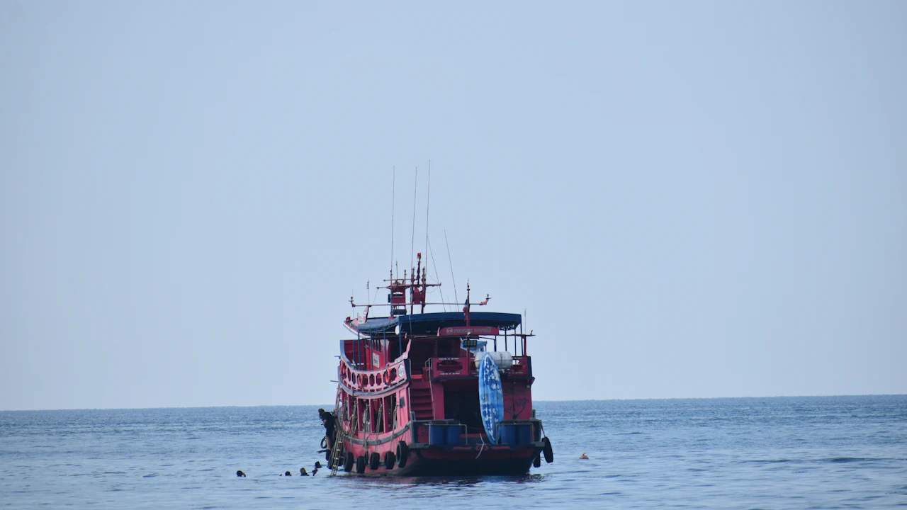 Dive boat anchored on a calm gray sea