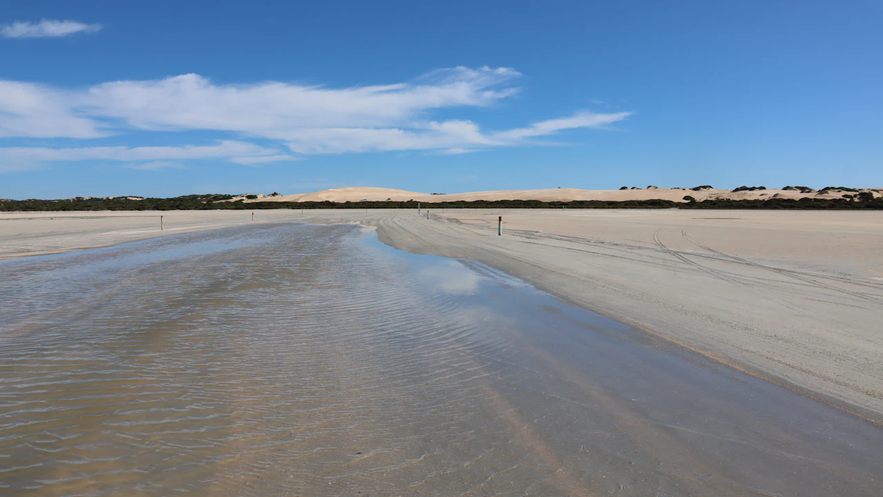 Wide empty beach at low tide